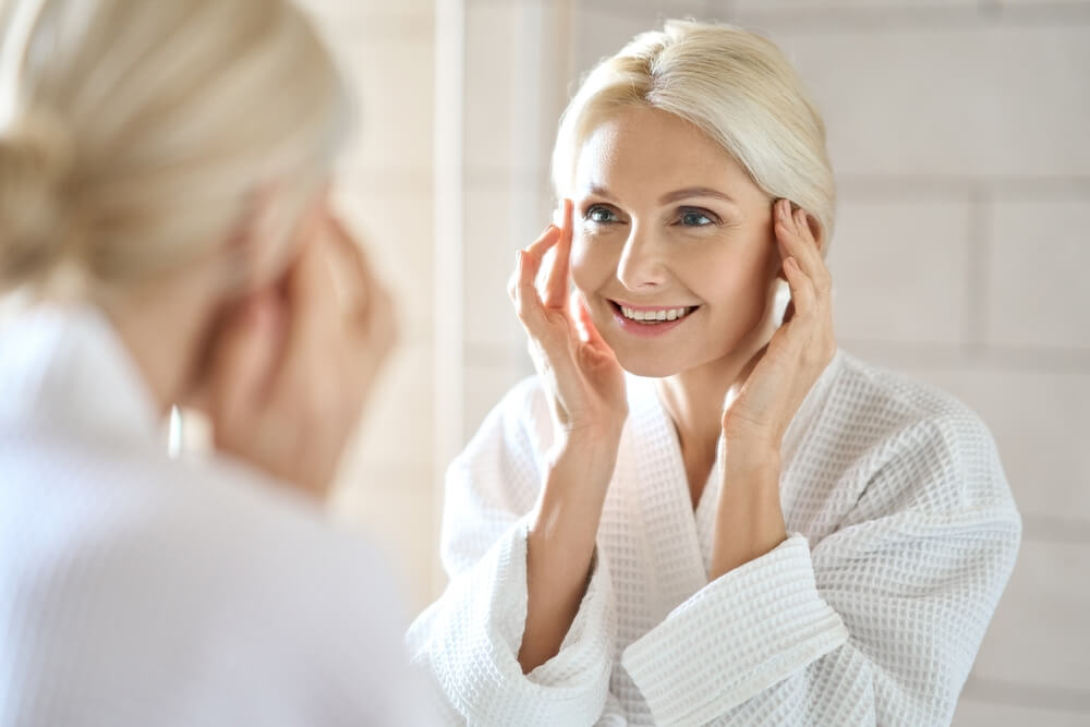 woman looking in mirror