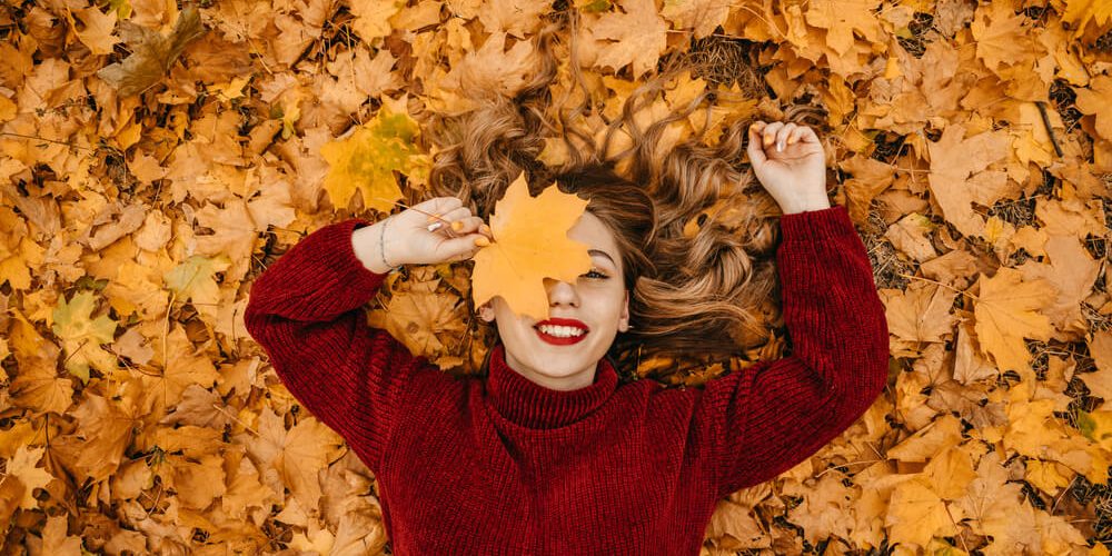 woman fall leaves