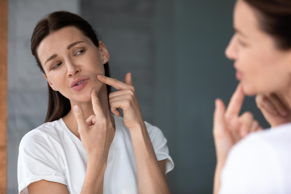 woman touching face