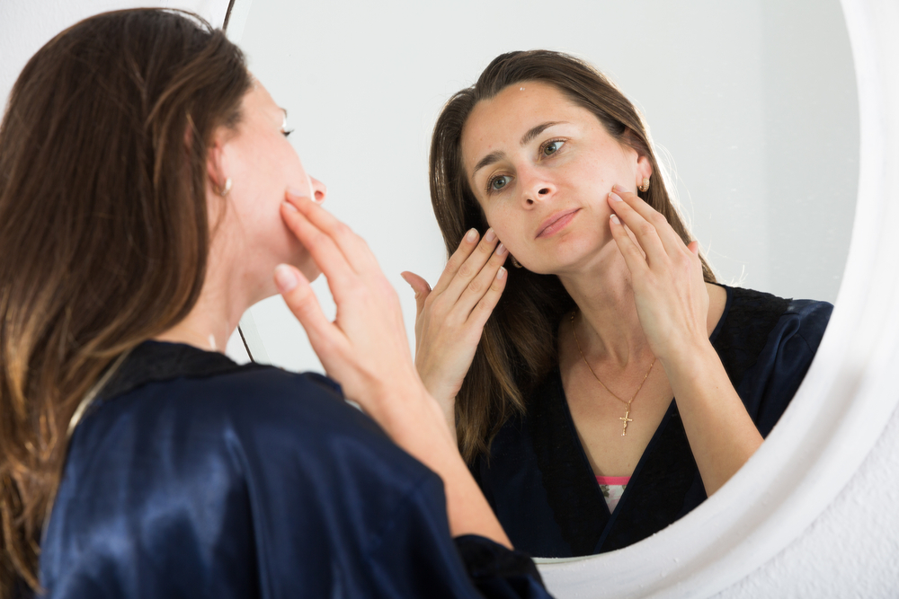 Woman looking at skin