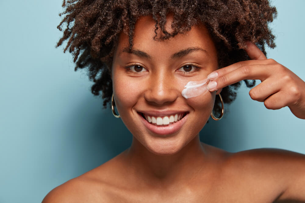 woman applying cream