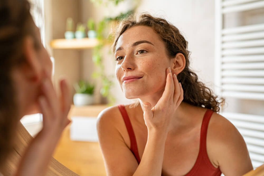 woman looking at face